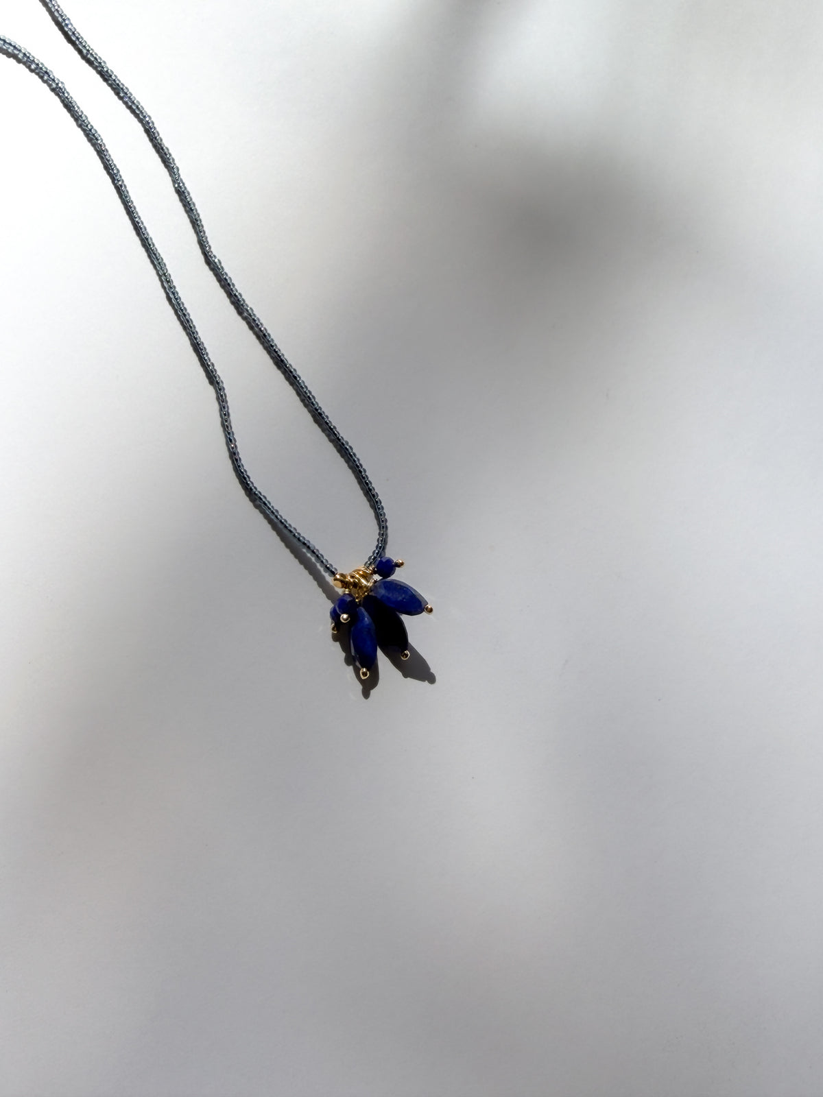 DEBBIE FISHER | Necklace of Grey Seed Beads with Lapis Bead Cluster