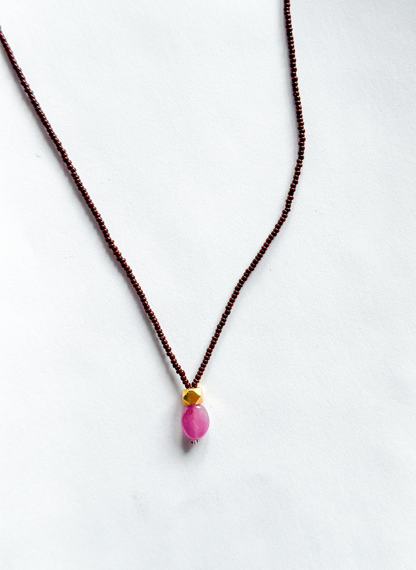 DEBBIE FISHER | Necklace of Brown Seed, Pink Amethyst pendant with gold beads