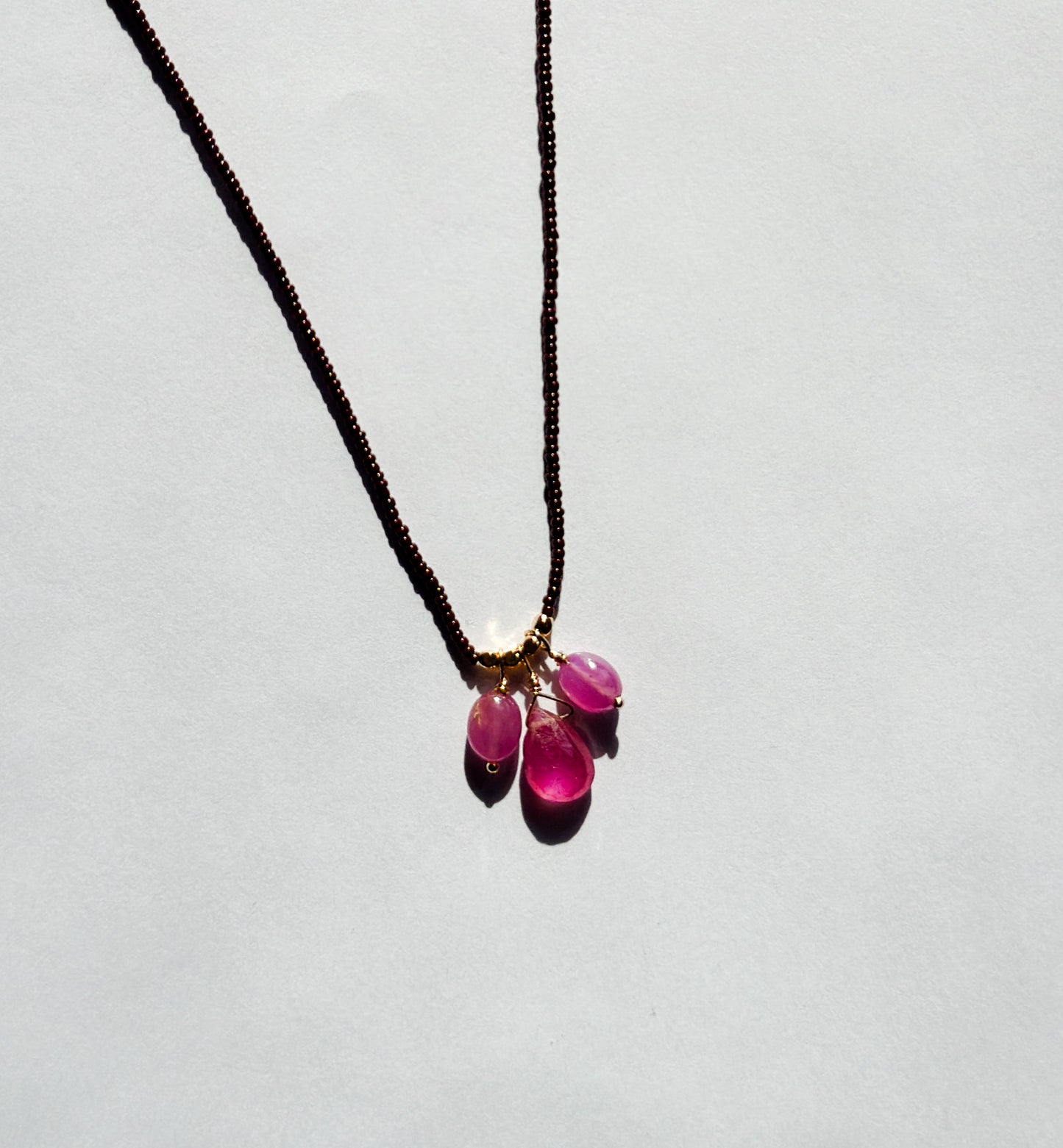 DEBBIE FISHER | Necklace of Brown Seed and Pink Sapphire Bead Drops