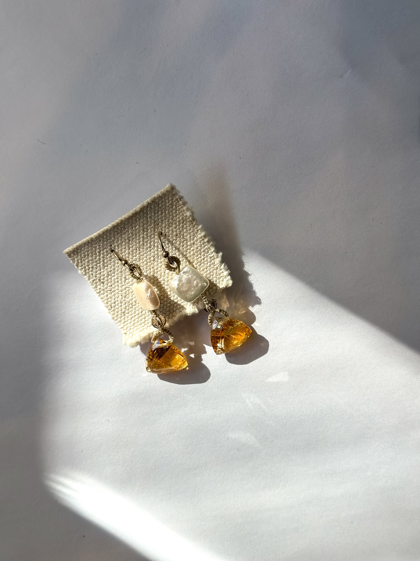 DANIELLE WELMOND | Woven Brown Cord Earrings with Citrine and Square Pearl Drops