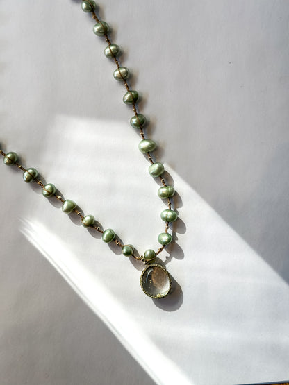 Danielle Welmond |  Necklace of Green Pearls, Gold Pyrite and Caged Aquamarine on silk cord
