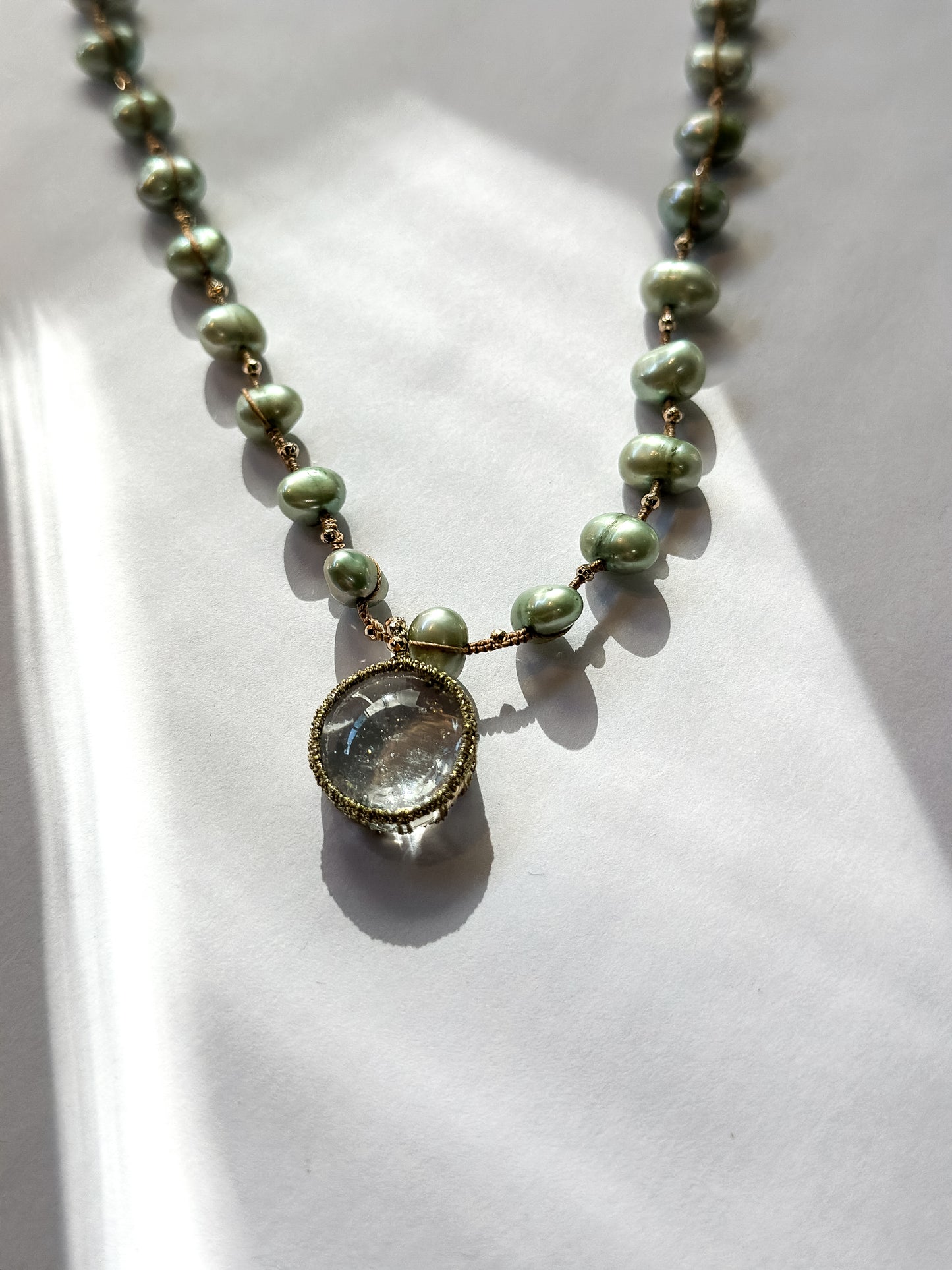 Danielle Welmond |  Necklace of Green Pearls, Gold Pyrite and Caged Aquamarine on silk cord