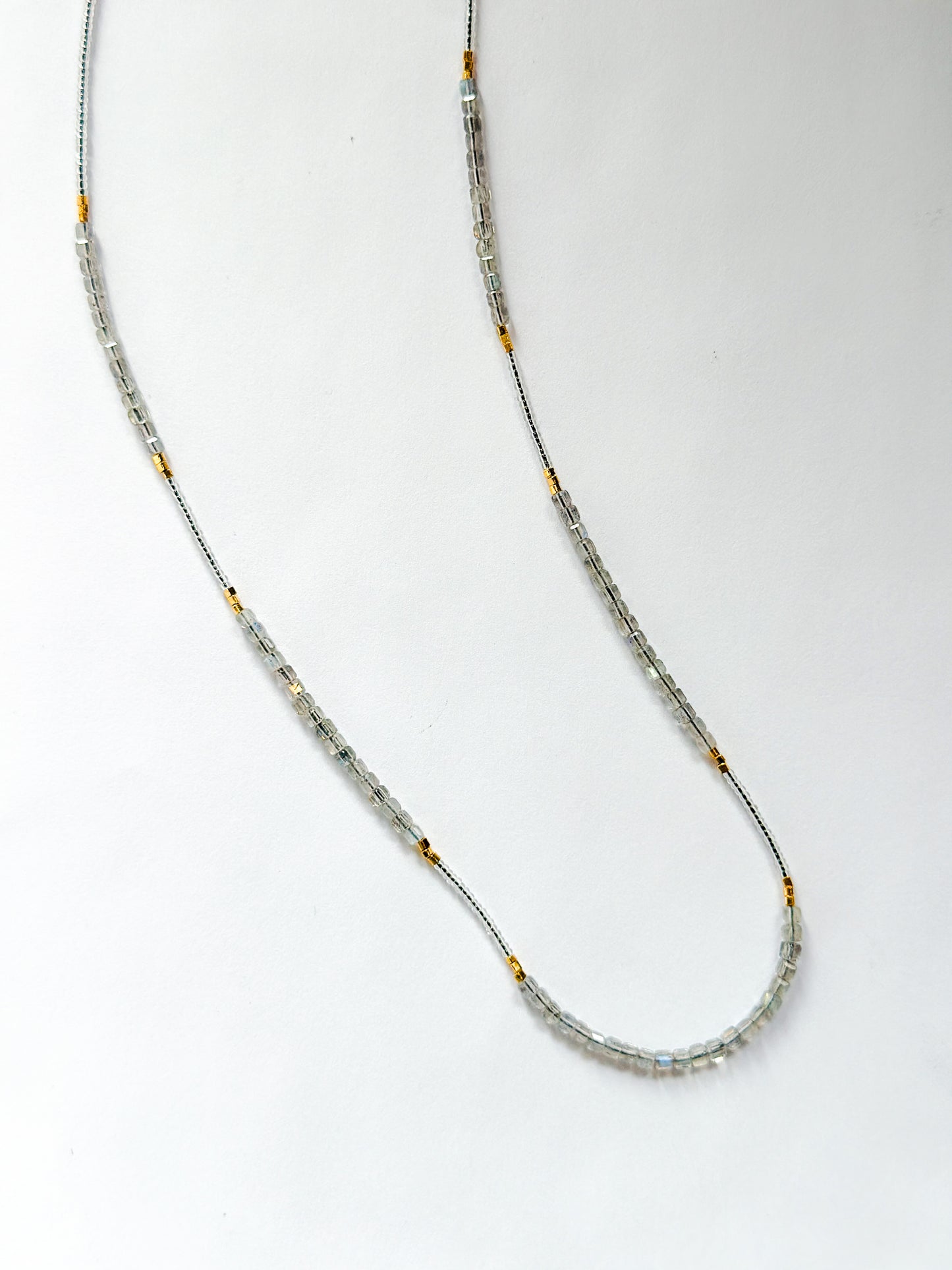 DEBBIE FISHER | Necklace of mixed Clear Glass Beads, Clear seed beads, and Gold beads
