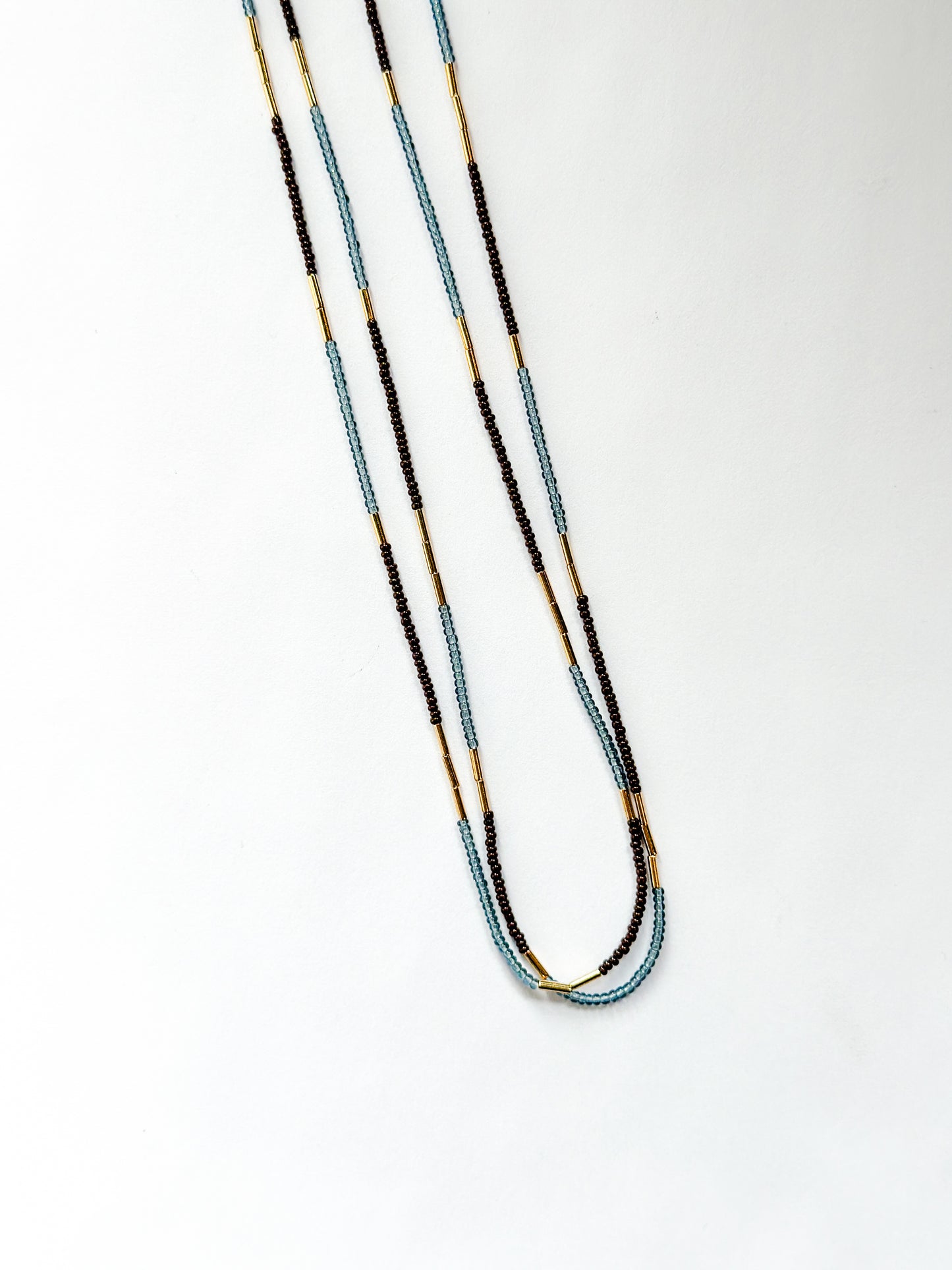 DEBBIE FISHER | Blue glass seed, gold beads, purple seeds