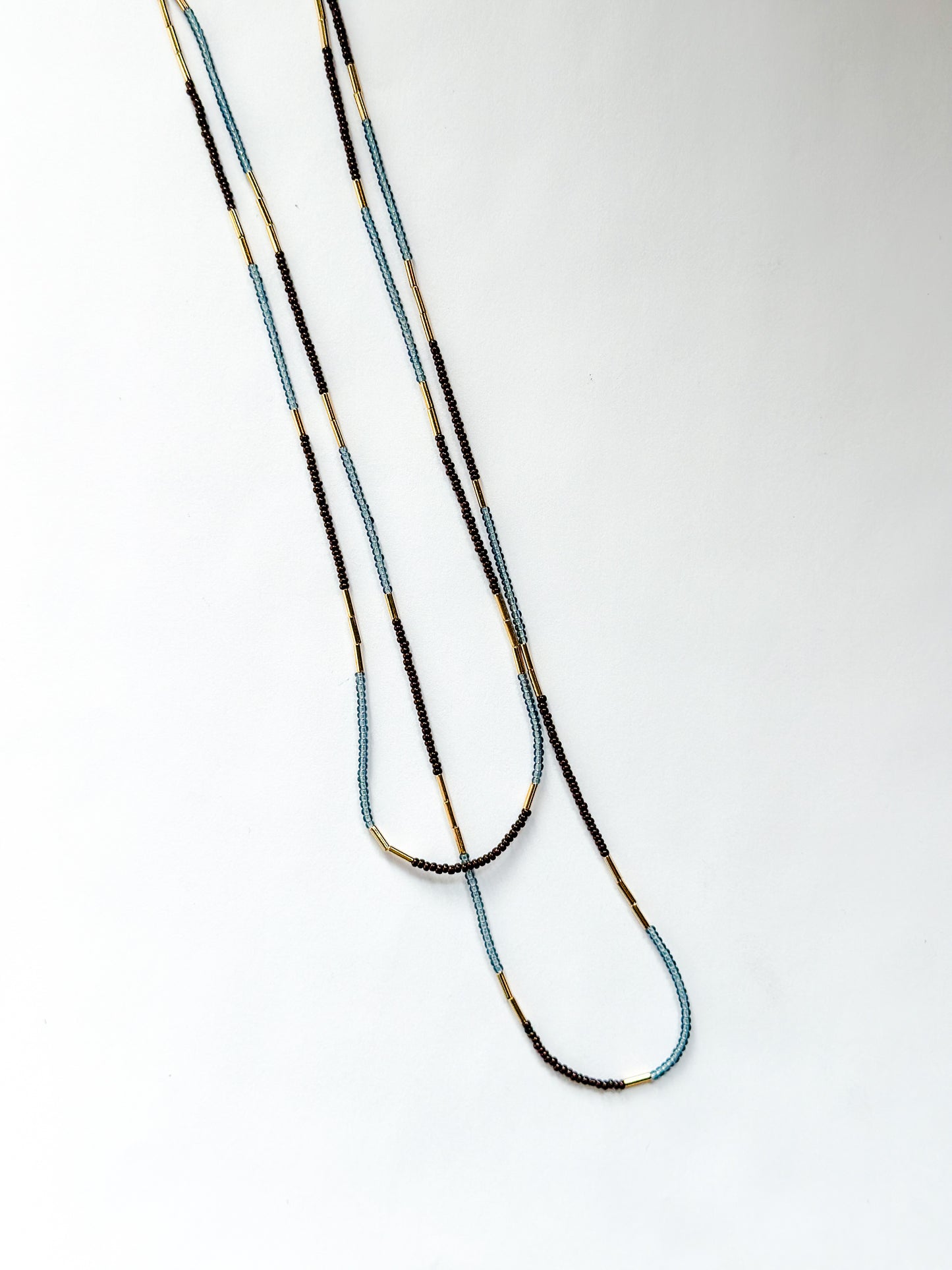 DEBBIE FISHER | Blue glass seed, gold beads, purple seeds