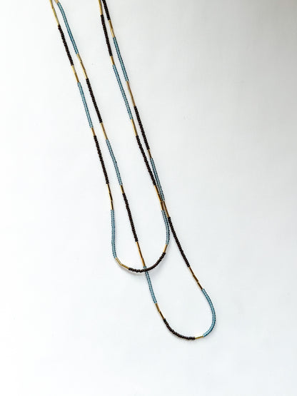 DEBBIE FISHER | Blue glass seed, gold beads, purple seeds