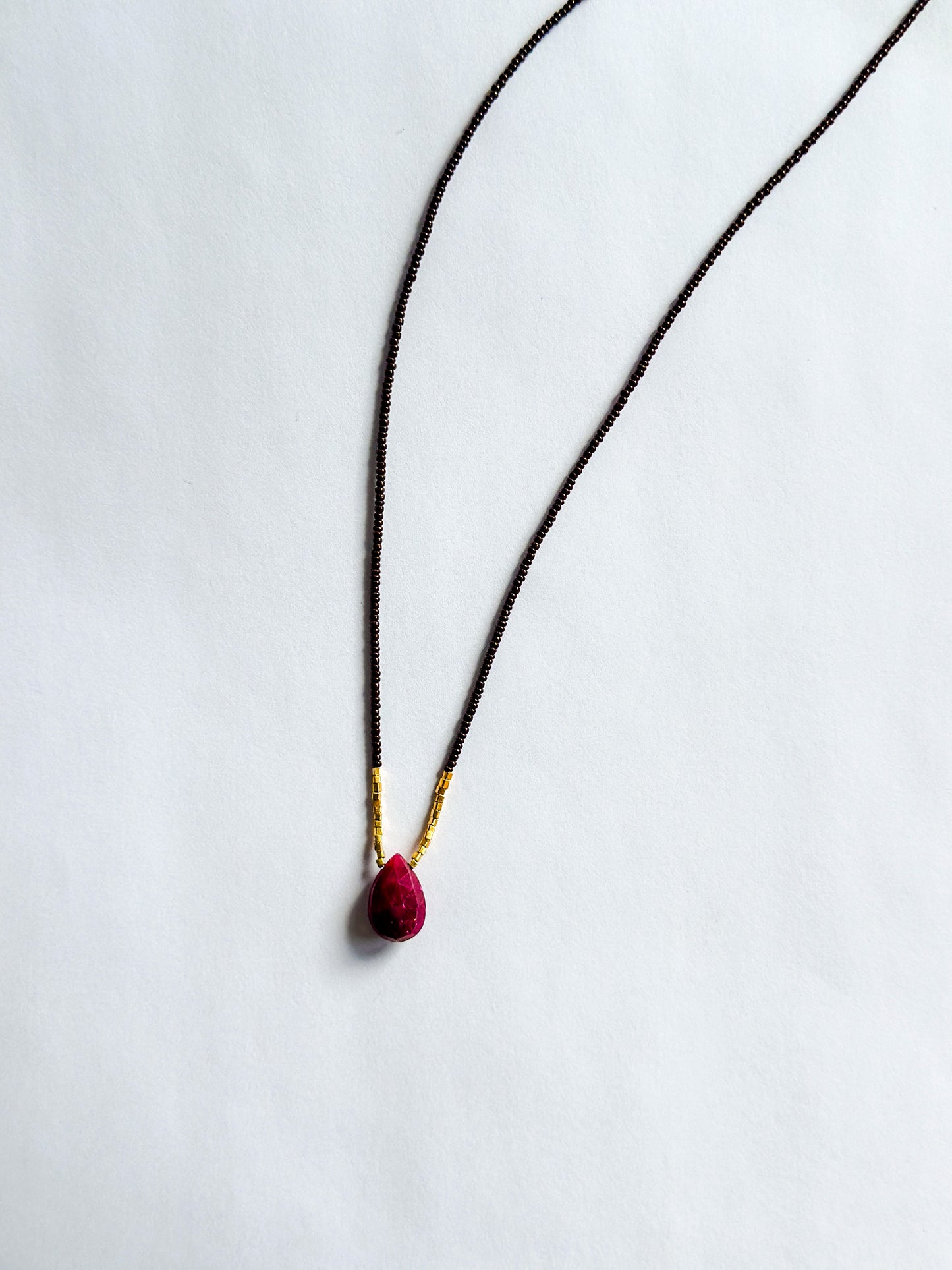 DEBBIE FISHER | Necklace of Brown Seed, Pink Amethyst pendant with centered gold beads